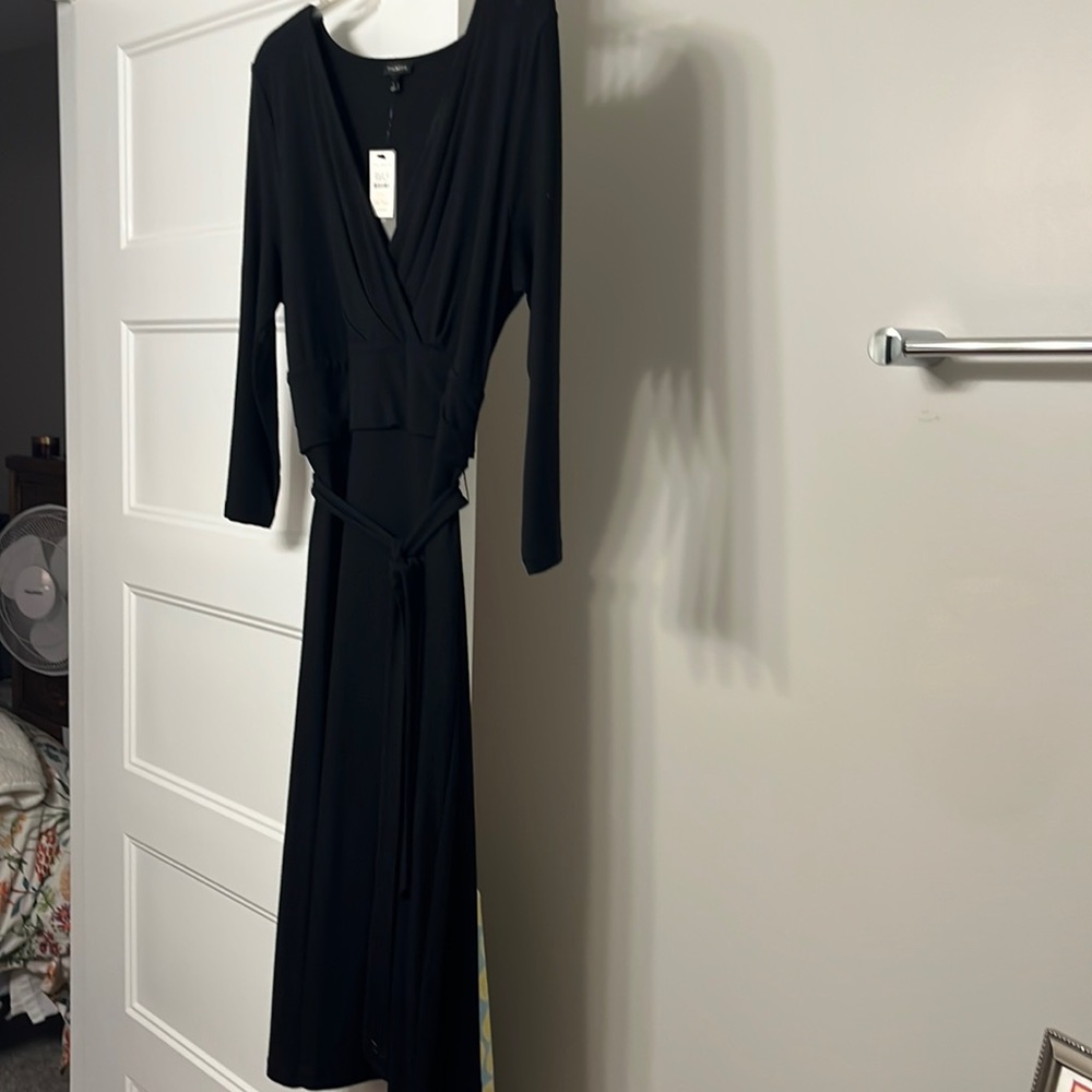 Never worn black dress.  Perfect for any occasion.